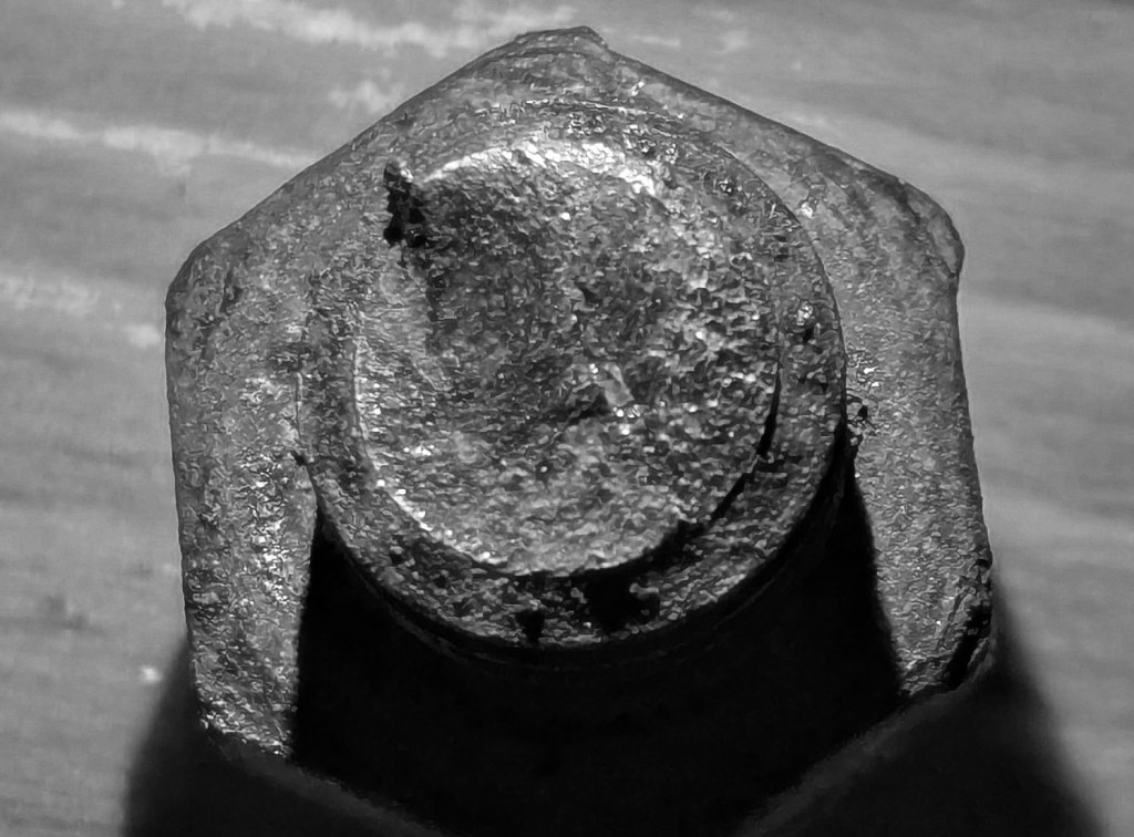 fracture surface of mild steel bolt